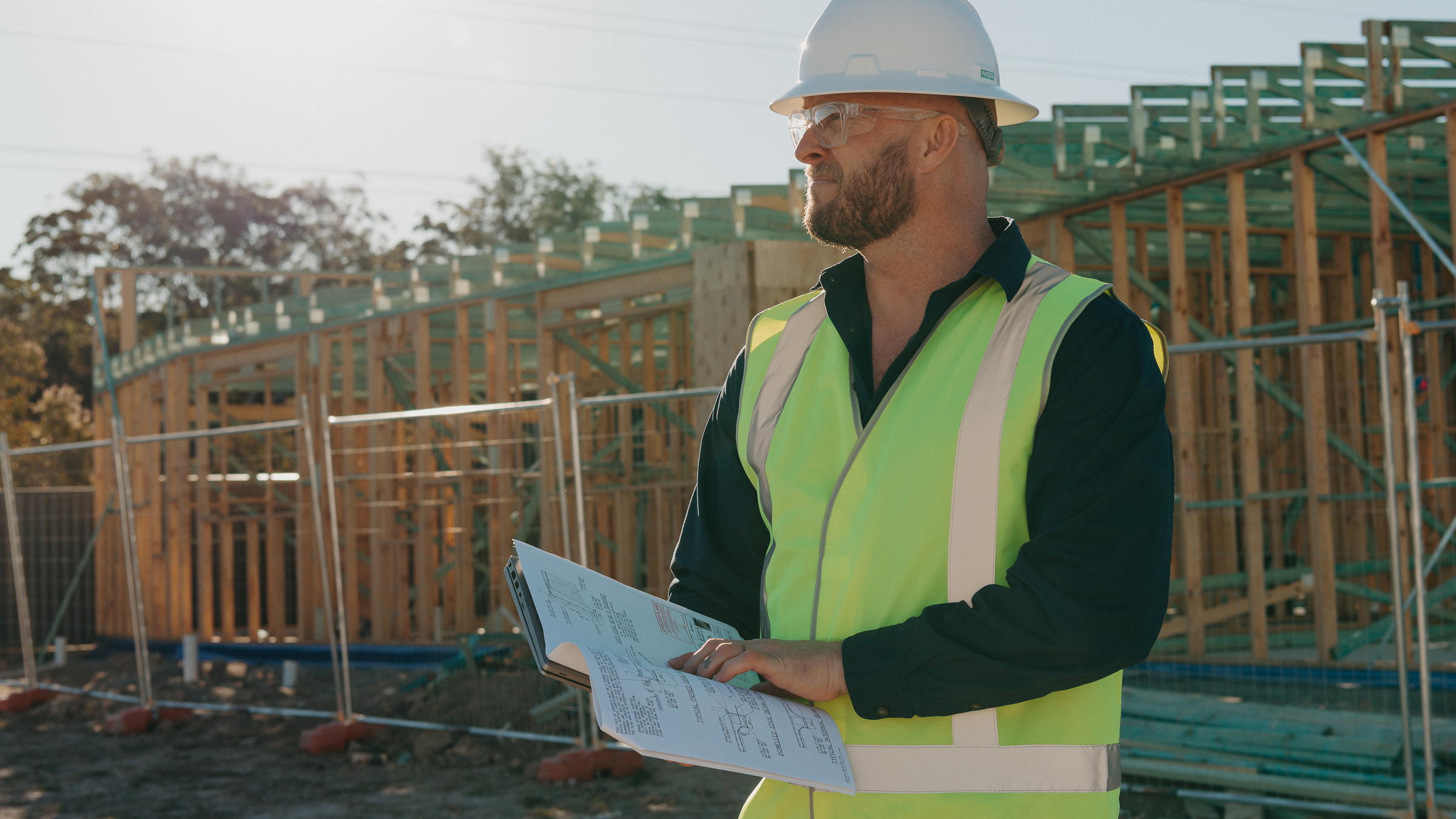 Toby McCosker on site at frame stage, timber-framed construction